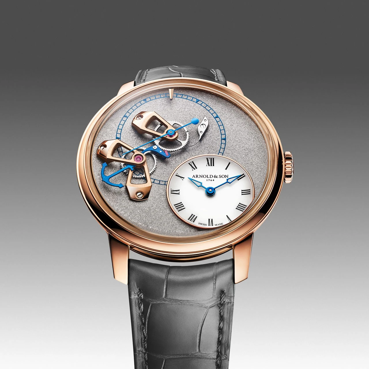Arnold & Son DSTB Stop-Seconds in red gold with a Cliff Grey dial and grey leather strap.